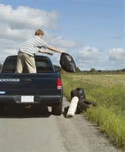 Person Throwing Trash Off of a Truck